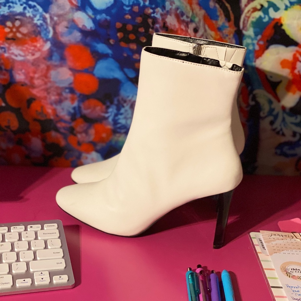 White ankle boots with black heel